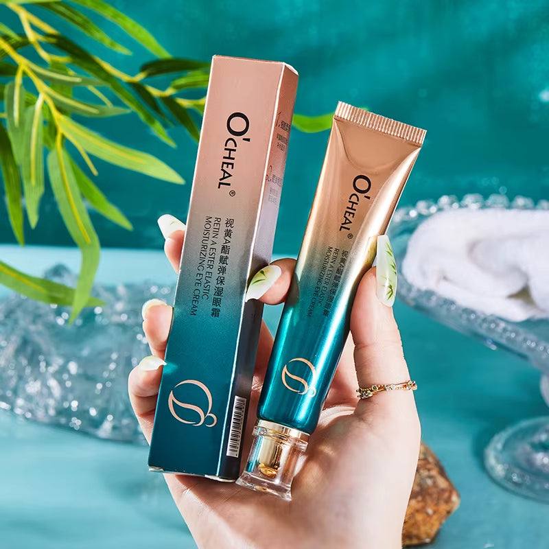 Moisturizing Eye Cream in a rose gold and teal tube, with matching ombré packaging and gold accents