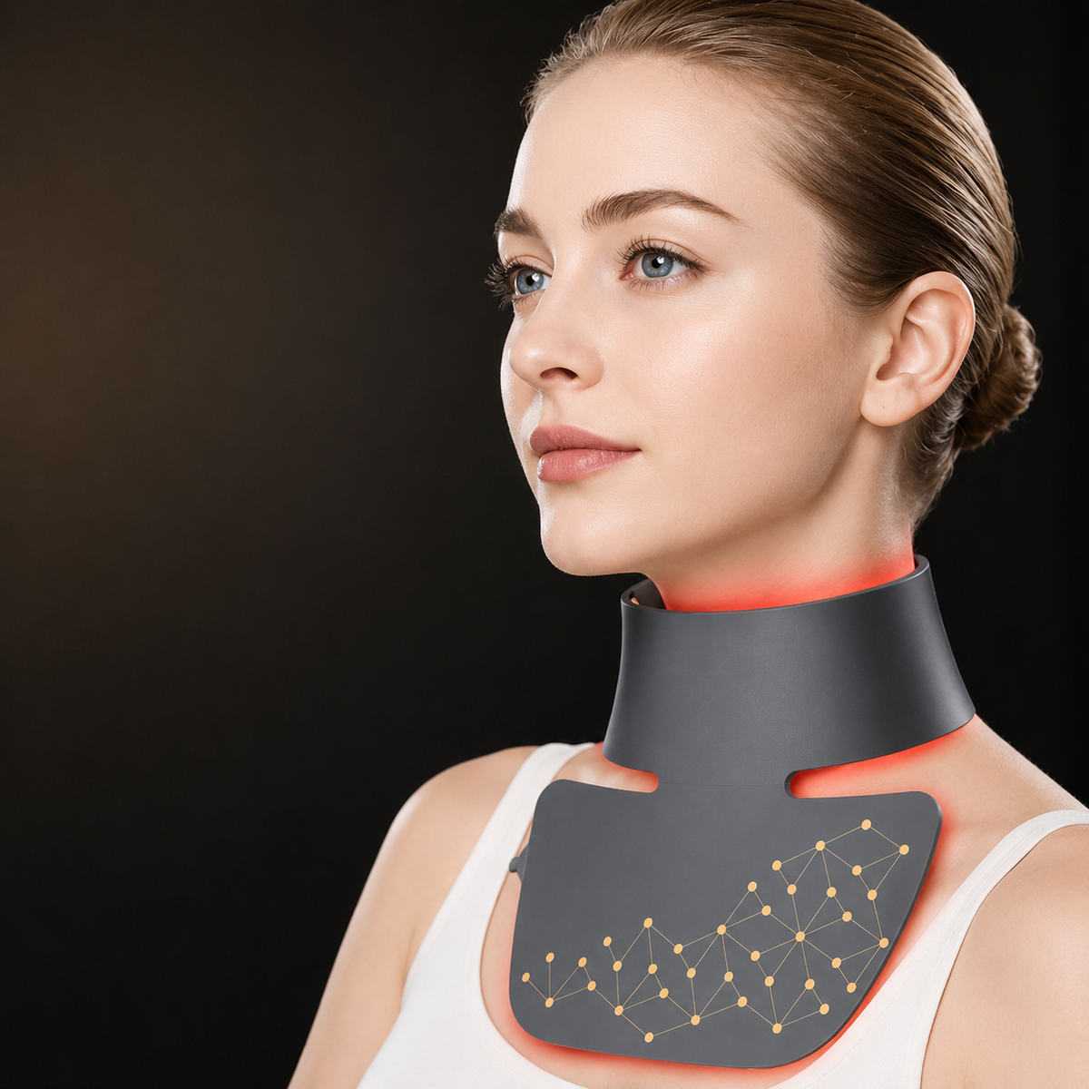 LED Neck Beauty Device in dark silicone, worn around the neck with glowing red LED therapy light and patterned panel