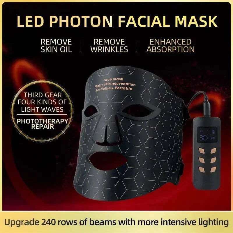 LED Light Therapy Facial Mask in black silicone with geometric pattern, eye and mouth cutouts, and handheld controller