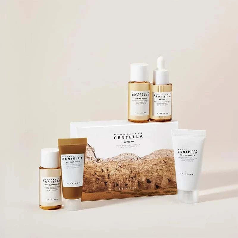 Centella Travel Skincare Kit with amber bottles, white tubes, and a scenic Centella-branded gift box set