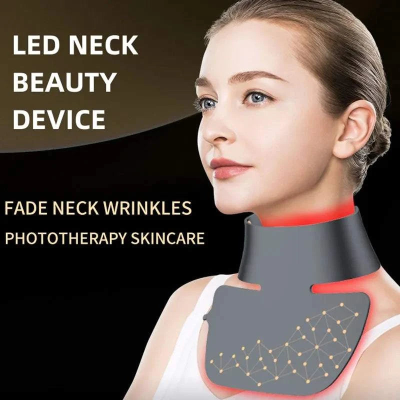 LED Neck Beauty Device in dark grey silicone with red trim and illuminated LED panel for wearable phototherapy skincare