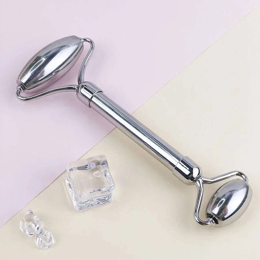 Ice facial roller set in polished stainless steel, featuring dual cooling rollers for facial massage and skincare care