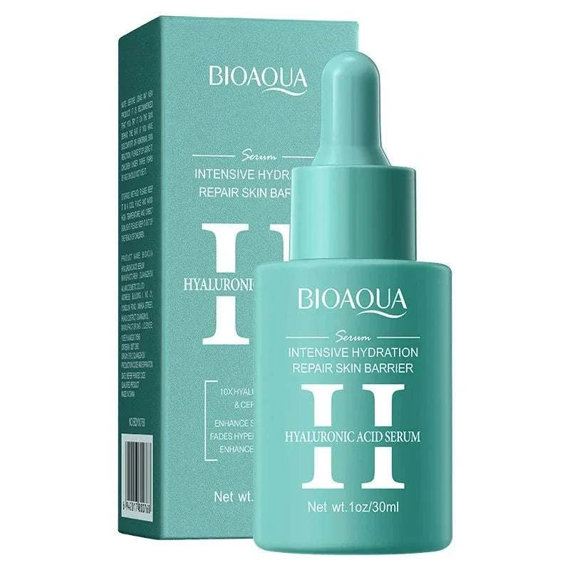 Facial Essence Serum in a teal glass dropper bottle with matching box, white text, and hyaluronic acid labeling.