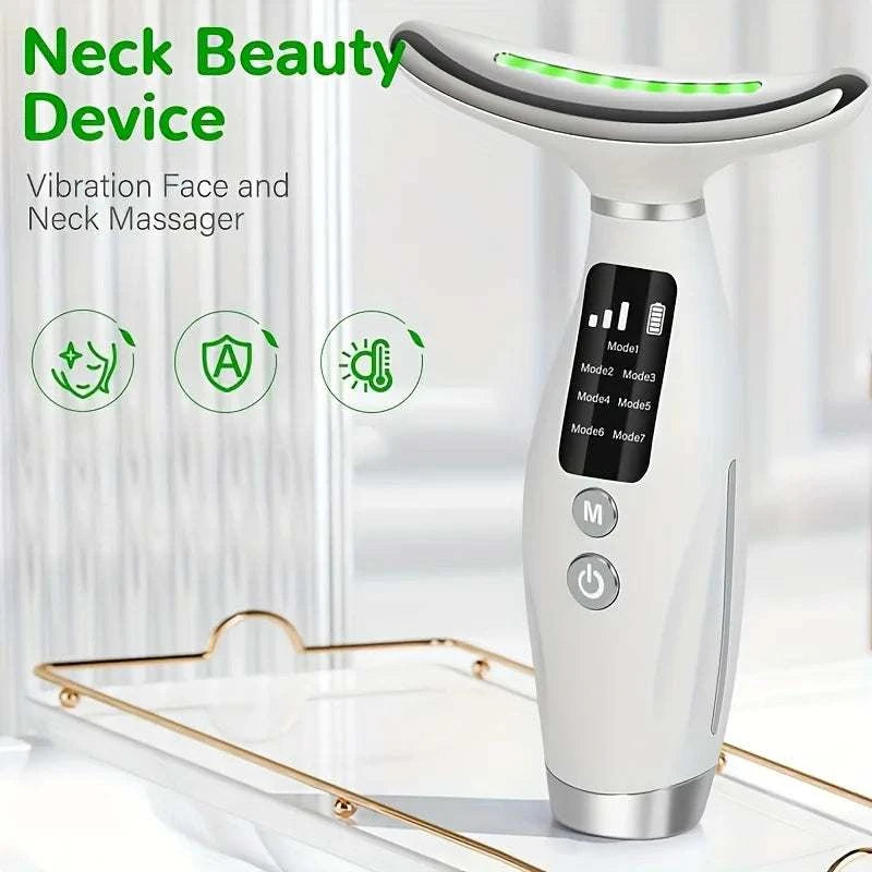 Face and neck vibration massager with white plastic body, curved metal head and 7 Colors LED Lights