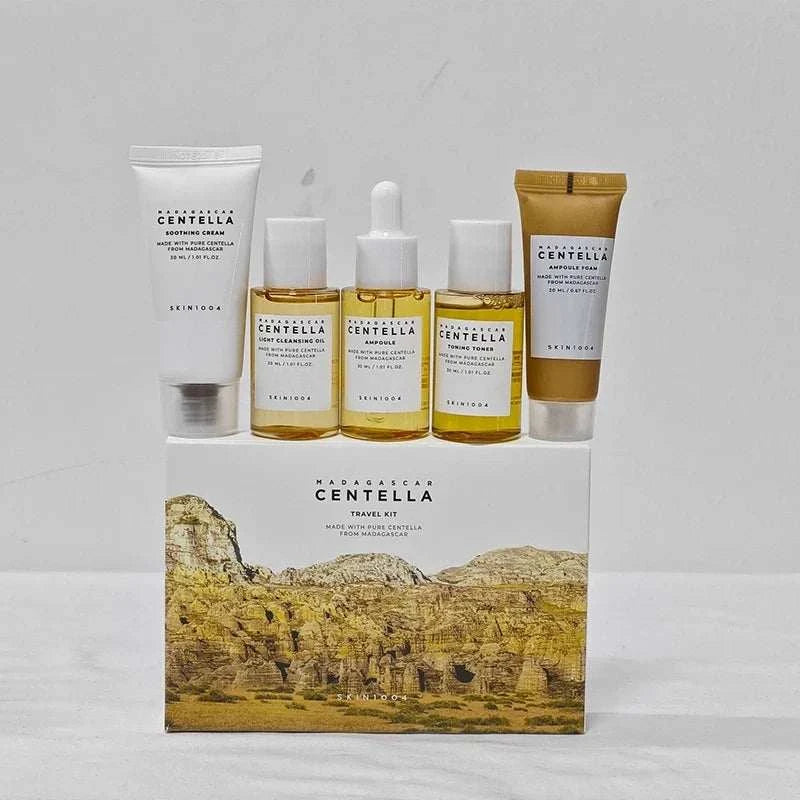 Centella Travel Skincare Kit with five travel-size skincare products in white, gold, and clear packaging