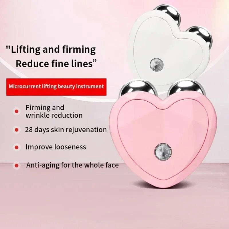 Micro Current Facial Device with pink heart-shaped ABS body, dual silver massage rollers, and central power button