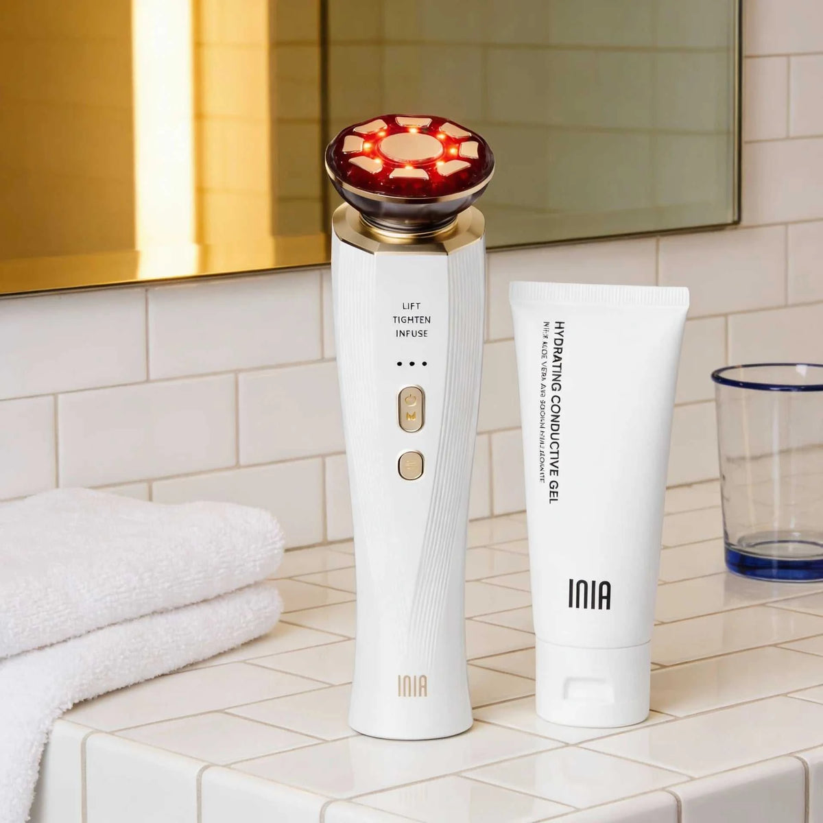 Three-In-One Red Light facial and neck beauty device in white plastic with red LED treatment head and massage function