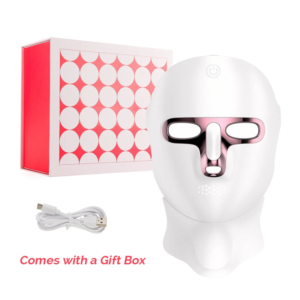 Rechargeable 7-Color LED Face mask in white plastic with pink trim, eye openings, and USB charging cable