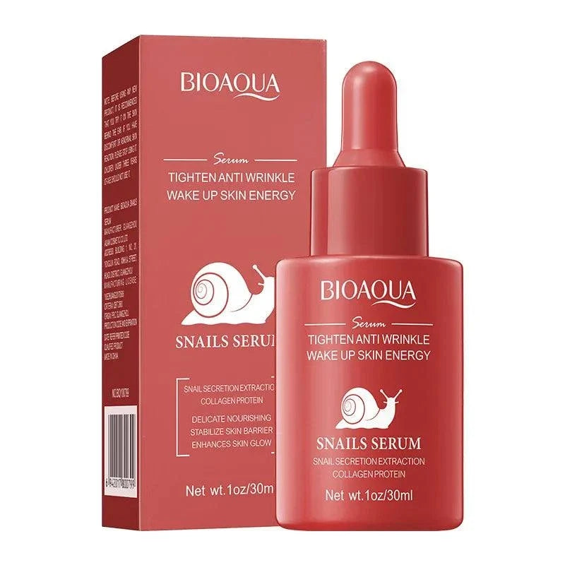 Facial Essence Serum in a coral-pink bottle with dropper, matching box, and white snail graphics and text.