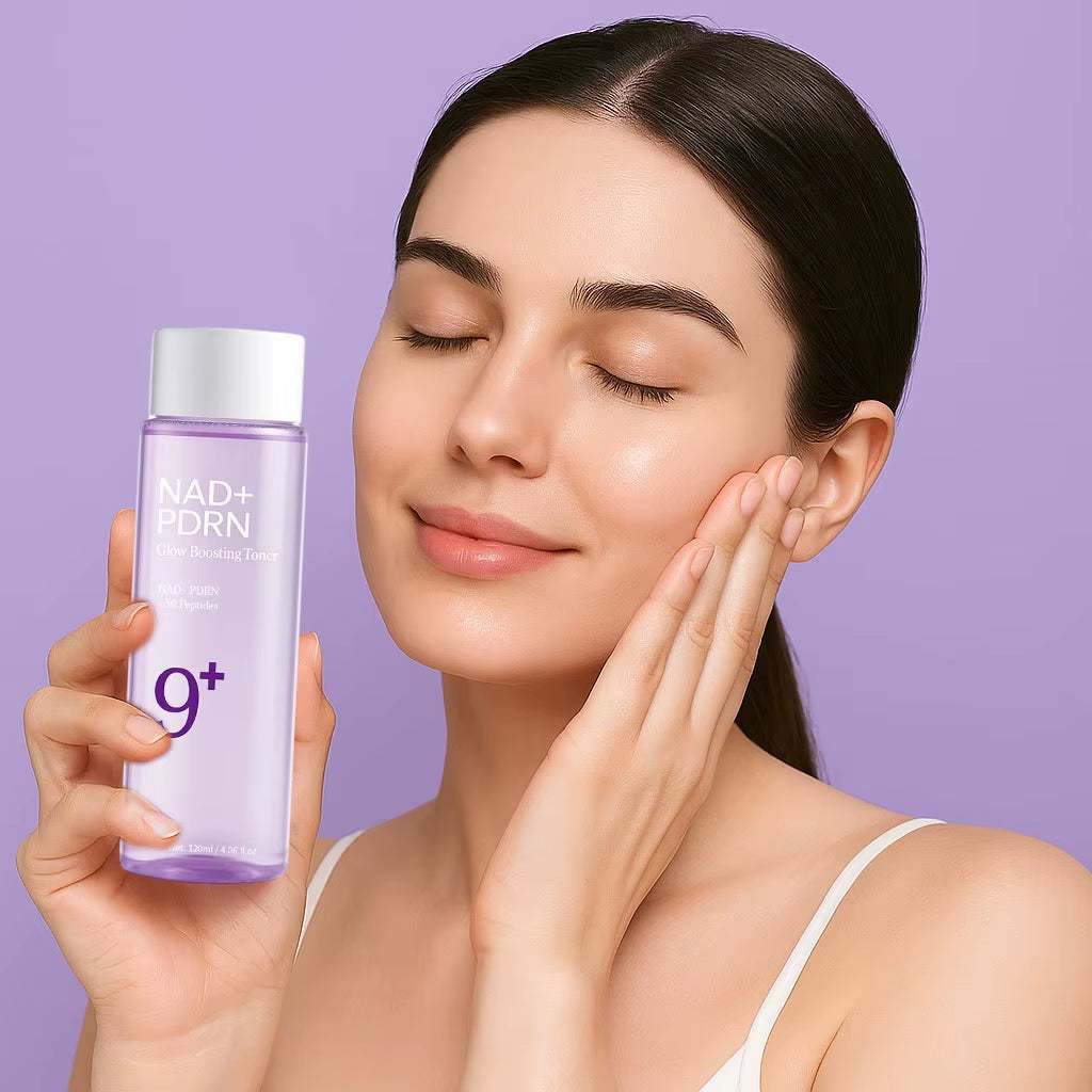 NAD+PDRN Glow Boosting Toner in a soft violet bottle with a silver cap and minimalist label