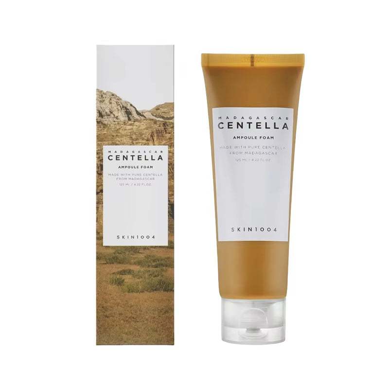 Korean Centella Series ampoule foam cleanser in a translucent amber tube with matching beige landscape box