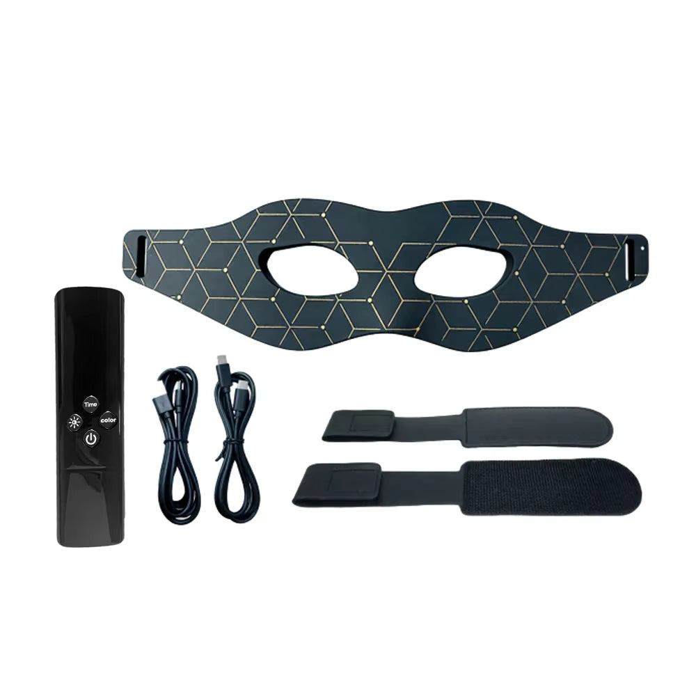 Red Light Eye Masks After 40: How to Use One Safely at Home, a dark eye mask with a gold geometric pattern, controller, cables and straps