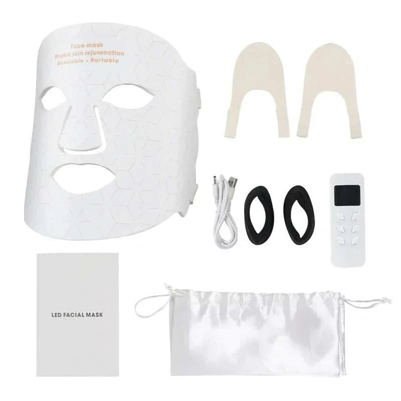 Face Photon Rejuvenation white plastic LED facial mask with geometric pattern, remote control, cables, eye pads, and storage pouch