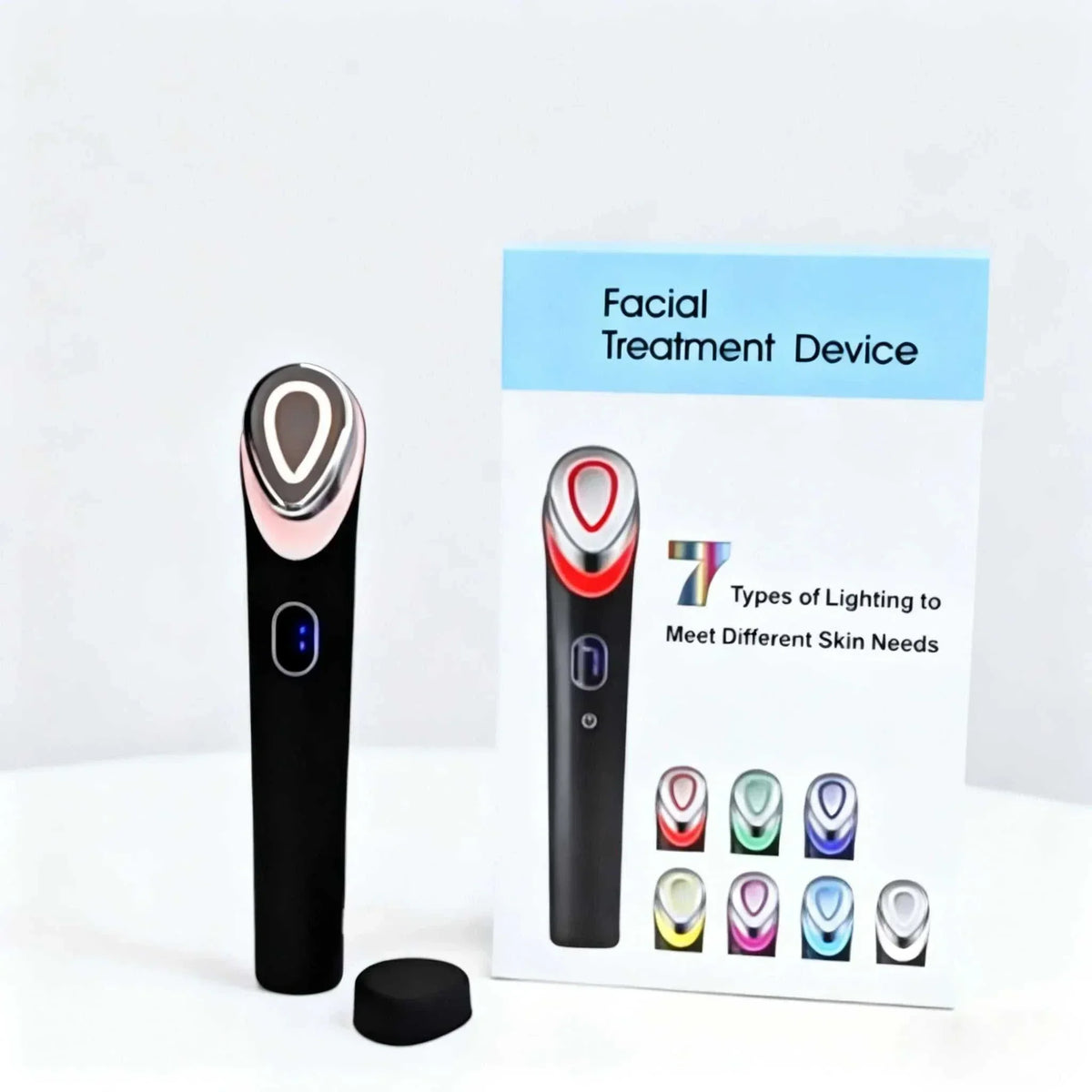 LED facial light therapy wand with a black plastic handle, metallic oval treatment head, blue display and seven color modes
