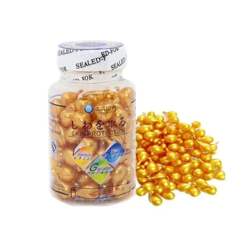 Brightening Anti Aging Serum in a clear bottle with amber-gold softgel capsules and matching loose capsules beside it