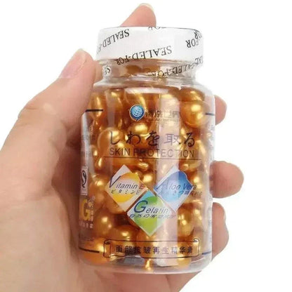 Brightening Anti Aging Serum in a clear bottle of golden gel capsules, with Vitamin E and Aloe Vera labels