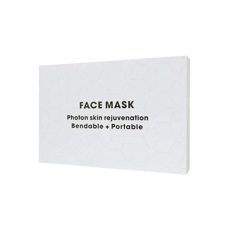 White rectangular box packaging for a Home Use Therapy Face Device with black text and subtle hexagonal pattern