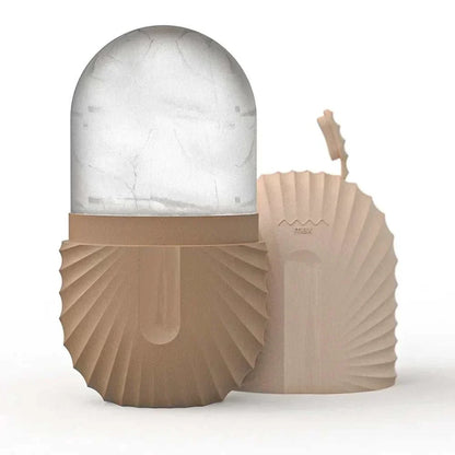 ice facial roller set with translucent ice dome, beige ribbed holders, and matching scalloped gua sha tool