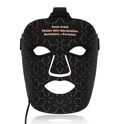 Black LED facial mask with geometric pattern and cutouts for eyes, nose, and mouth designed for Infrared Light Therapy skincare.