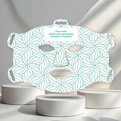 Infrared Light Therapy face mask with teal geometric pattern, bendable and portable design for photon skin rejuvenation