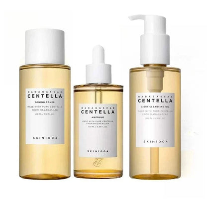 Korean SKIN1004 Skincare Centella three-piece set with clear amber toner, ampoule dropper bottle, and cleansing oil pump bottle