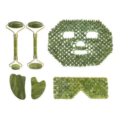 Natural Xiuyan Jade facial massage set in mottled green stone, with two rollers, gua sha scrapers and a beaded face mask