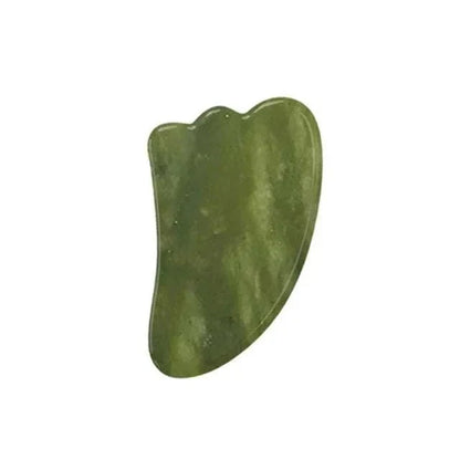 Gua sha facial massage tool in mottled dark green Natural Xiuyan Jade with a smooth, curved scraping edge