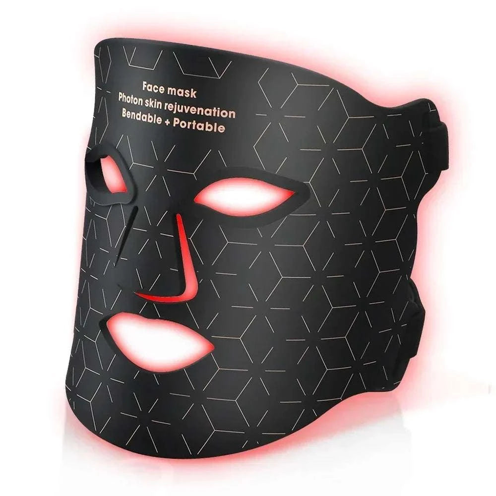 Black silicone LED face mask with geometric pattern and glowing red light edges for Red Light Photon Therapy skincare