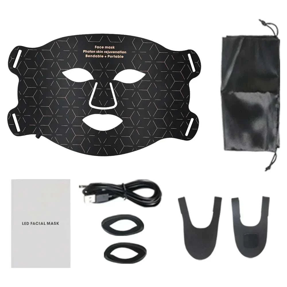 Black silicone LED facial mask with geometric patterns, adjustable straps, a USB cable, two black attachments, a pouch, and an instruction manual for Red Light Photon Therapy